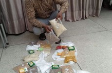 The Pastor in Pakistan showing the food and soap he has got before it is being packed up to give to his congregation